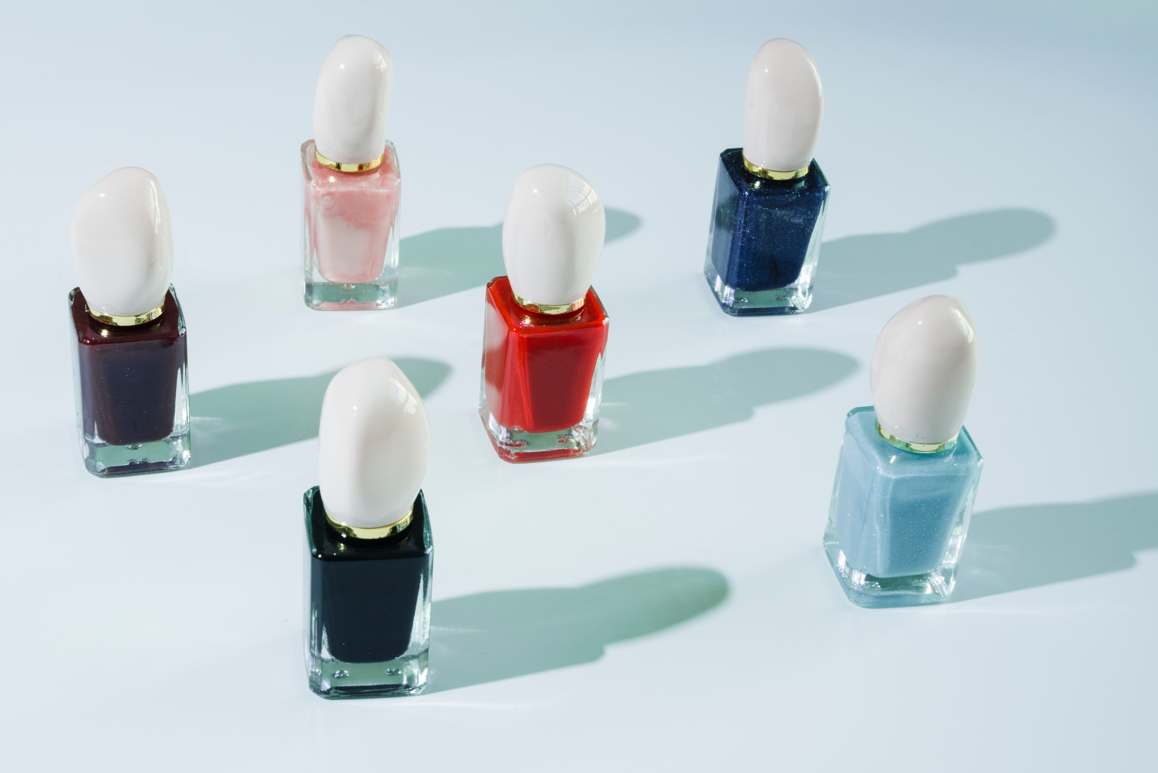 Collection of luxury nail lacquers on glass